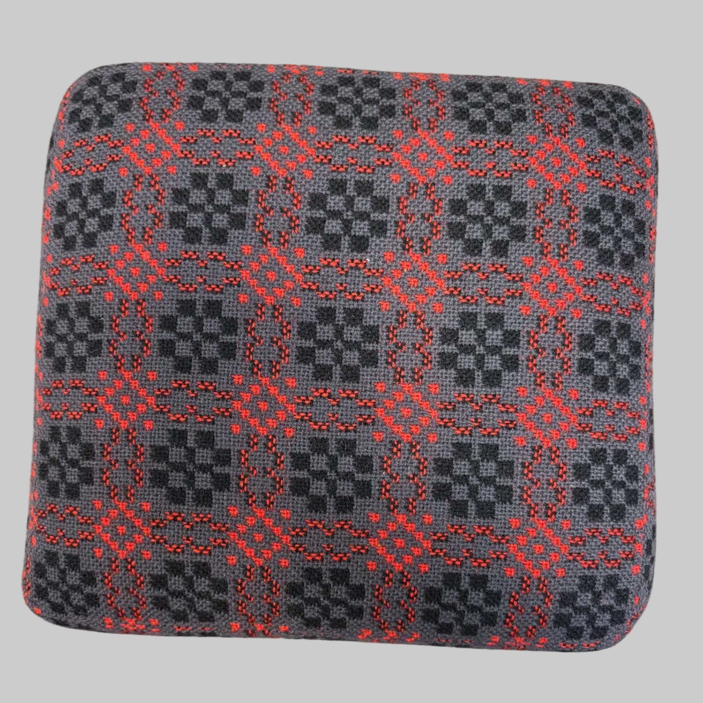 Top of Black and red Welsh tapestry foot stool