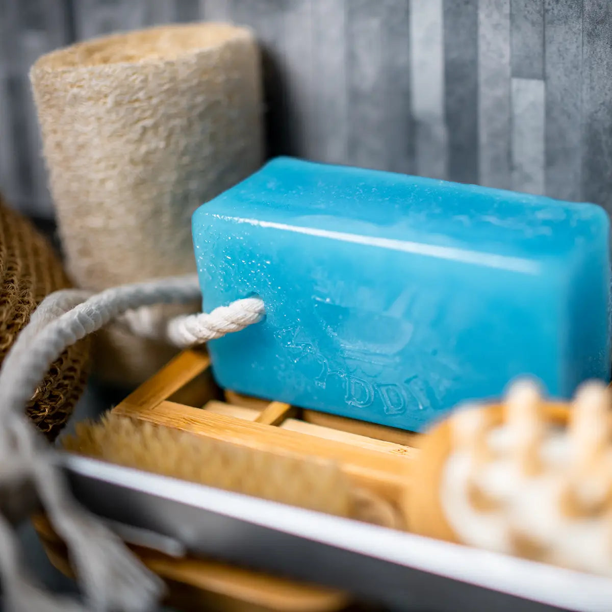 A bar of Cole and co handmade Welsh soap on a rope
