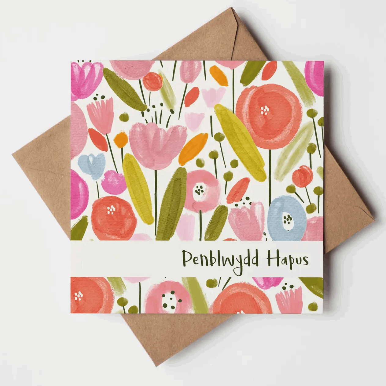 Floral card with 'Penblwydd Hapus' text on a white background
