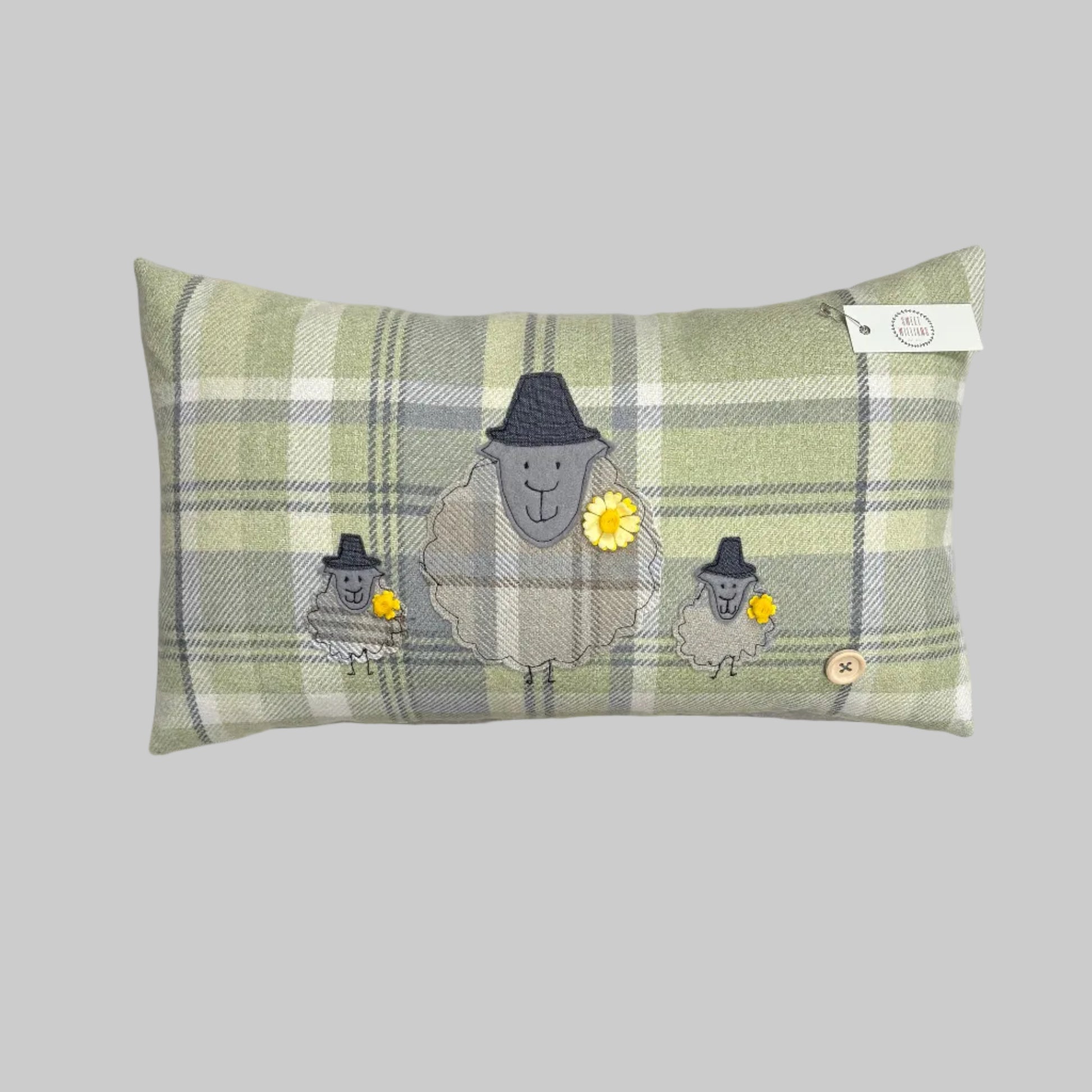 Green sheep cushion with lambs 