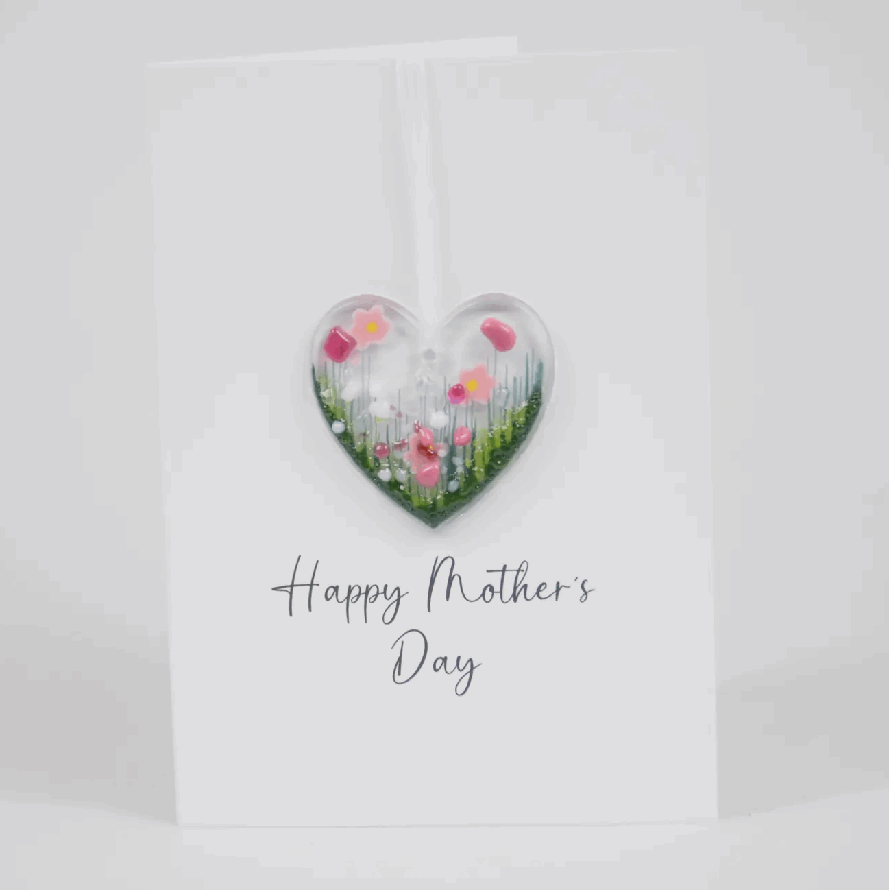Mothers day card with pink flower heart decoration