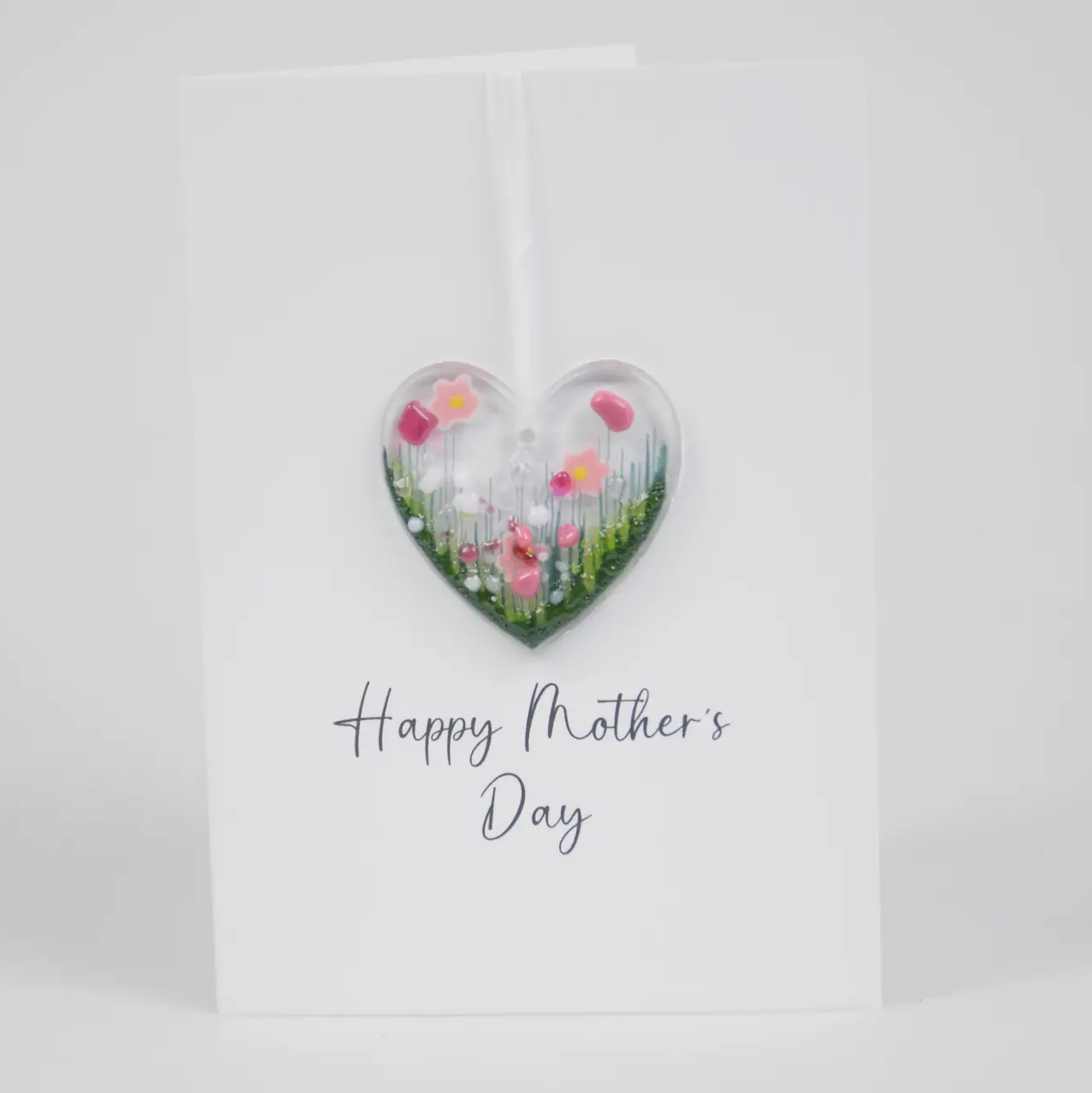 Mothers day card with pink flower heart decoration