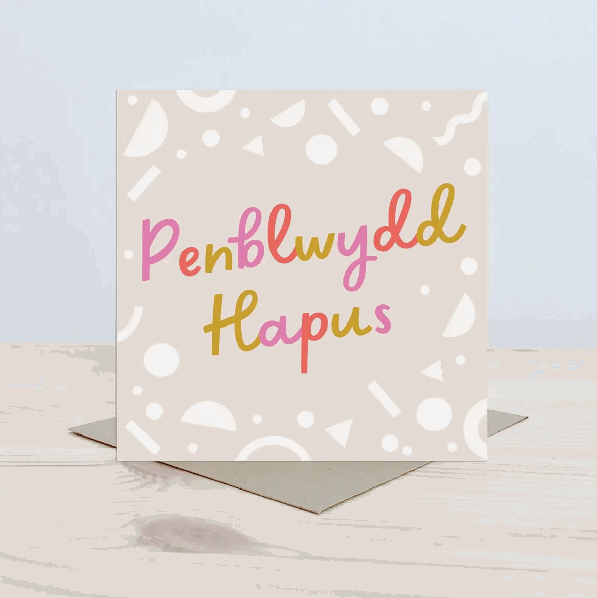 Penblwydd hapus card with bright text and neutral background
