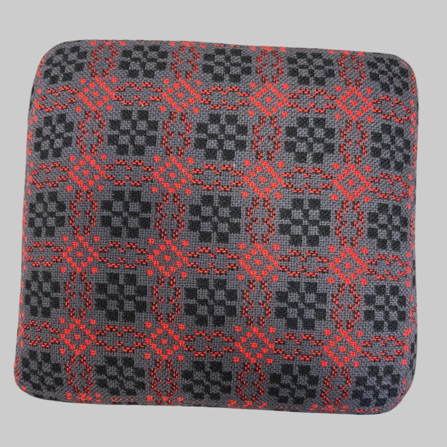 Top of Black and red Welsh tapestry foot stool
